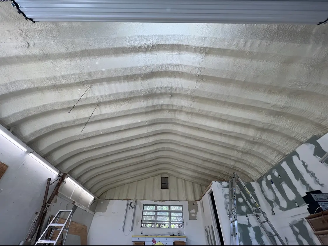Spray polyurethane foam applied to the underside of a metal roof deck in North Chicago